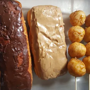 Chocolate and Maple Bars ($2.35 ea), two Kariokas ($2.80 ea). Paper bag effed up the original nice glaze (3/25/22)