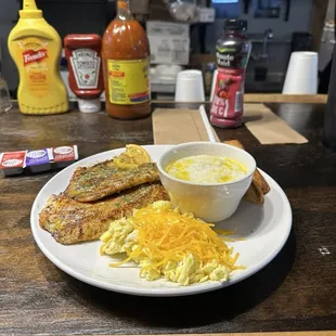 Grilled Talpia 2 pieces scrambled eggs with cheese grits and toast