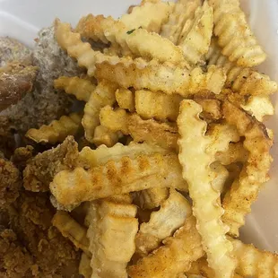 a close up of a meal in a styrofoam container