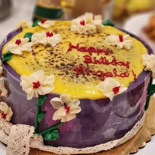 Ube creme brûlée cake with floral design