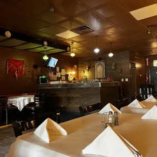 a dining area with tables and chairs