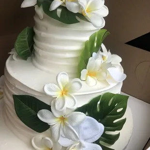 a wedding cake with white flowers