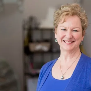 a woman in a blue top