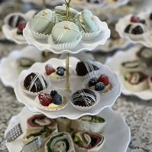 At baby shower tea party: custom macarons, mini cream puffs and fruit tartlets