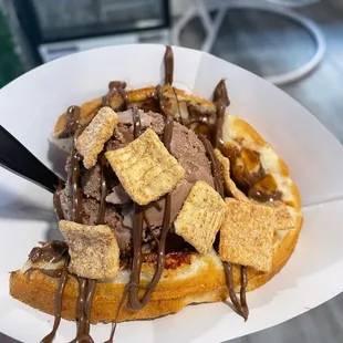a waffle topped with chocolate and marshmallows