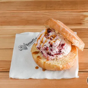 a strawberry cream sandwich on a napkin