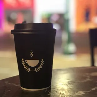 a coffee cup on a table