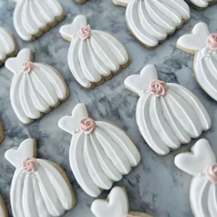 wedding dress cookies on a table