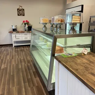 a bakery counter with a display case