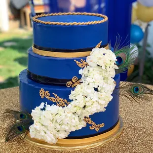 Custom tiered cake with fresh flowers
