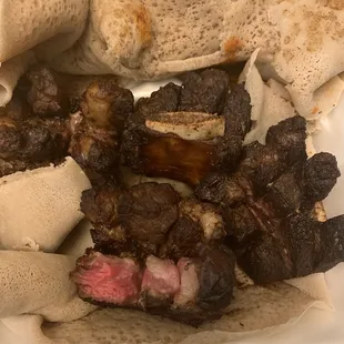 Is this beef? And is this cooked in onions and peppers? Ive been robbed!