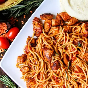 a plate of spaghetti and meat