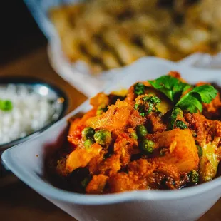 a bowl of curry and a bowl of rice