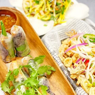 Salmon bellies rolls, calamari, mango squid salad