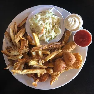 Friday Special. Catfish, Shrimp, hushpuppies hiding under a pile of fries and fresh coleslaw on the side.