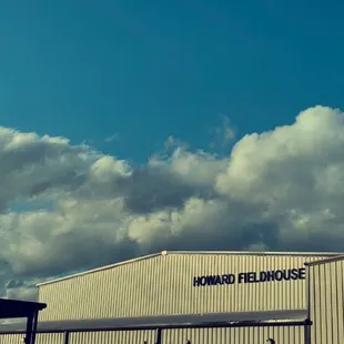 A picture of the clouds over the gymnasium and cafeteria