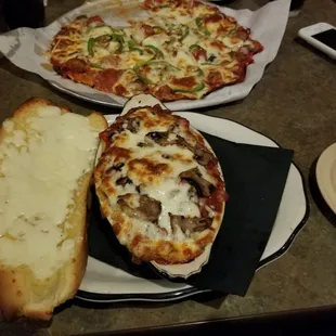 Two HUGE pieces of garlic cheese bread with my rigatoni. Supreme pizza was very good too.