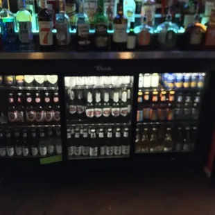 a display of alcohol bottles in a bar