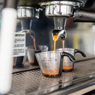 an espressor being filled with coffee