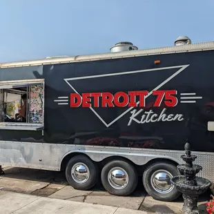 a food truck parked on the side of the road