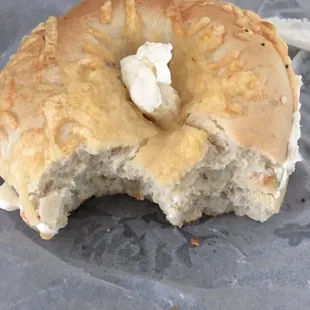 Asiago bagel toasted and sliced with veggie cream cheese