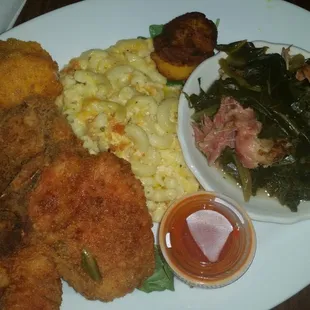 Pork Chops with 2 sides. $ 12 Mac and Cheese and Collard Greens