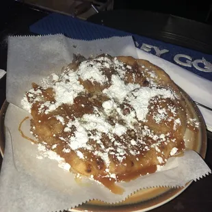 a pizza covered in powdered sugar