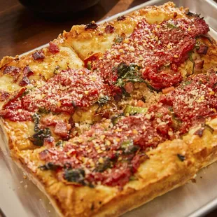 a square pizza on a tray