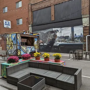 an outdoor seating area in the middle of the street