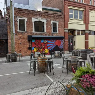 a brick building with a mural on the side