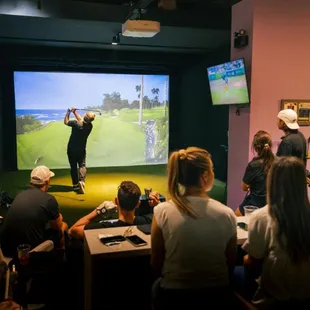 a group of people playing golf