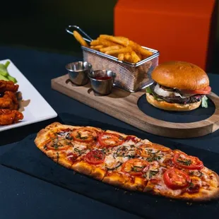 a pizza, fries, and a burger