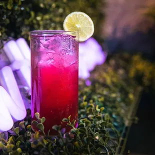 a drink with a lime slice on the rim