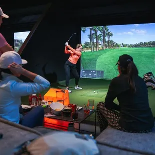 a group of people playing golf