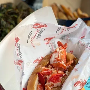 a lobster sandwich in a paper wrapper