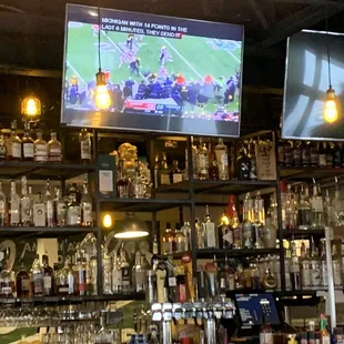a bar with many bottles of alcohol