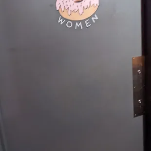 Woman&apos;s restroom door