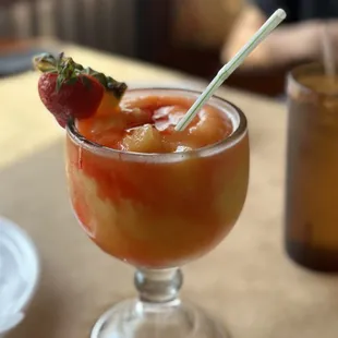 a close up of a drink with a straw