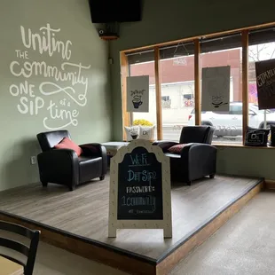 There are lots of tables and chairs to study at and even a few cozy chairs by the window.