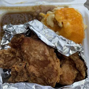 fried chicken and macaroni in a styrofoam container