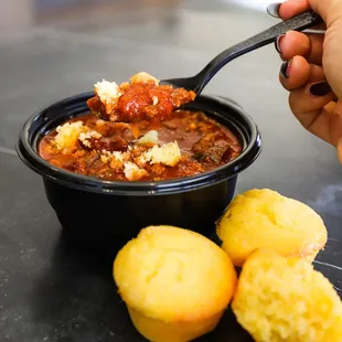 a bowl of chili and cornbreads