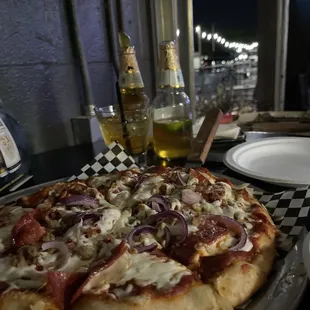 a pizza with pepperoni and onions