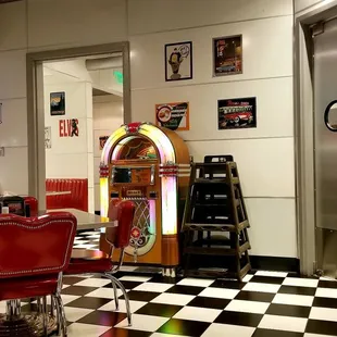 a checkered floor and a jukebox