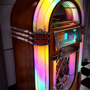 a juke box with a clock