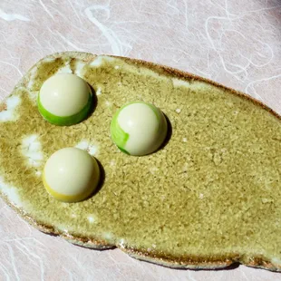 three eggs on a piece of bread