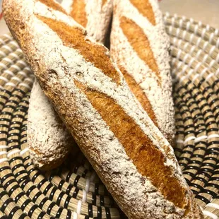 two loaves on a woven basket