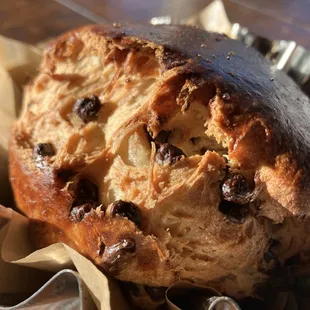 a muffin with raisins on it