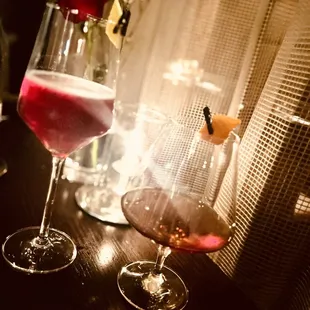 two glasses of wine on a table