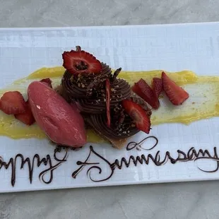 Chocolate ganache and mousse with mango coulis and fresh fruit