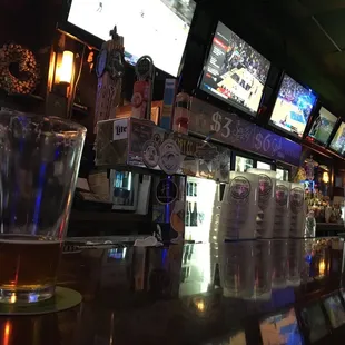 a beer glass on the bar